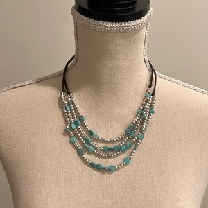 Layered fashion necklace.
